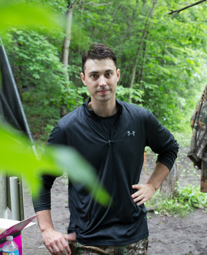fit young man looking into the camera while exercising